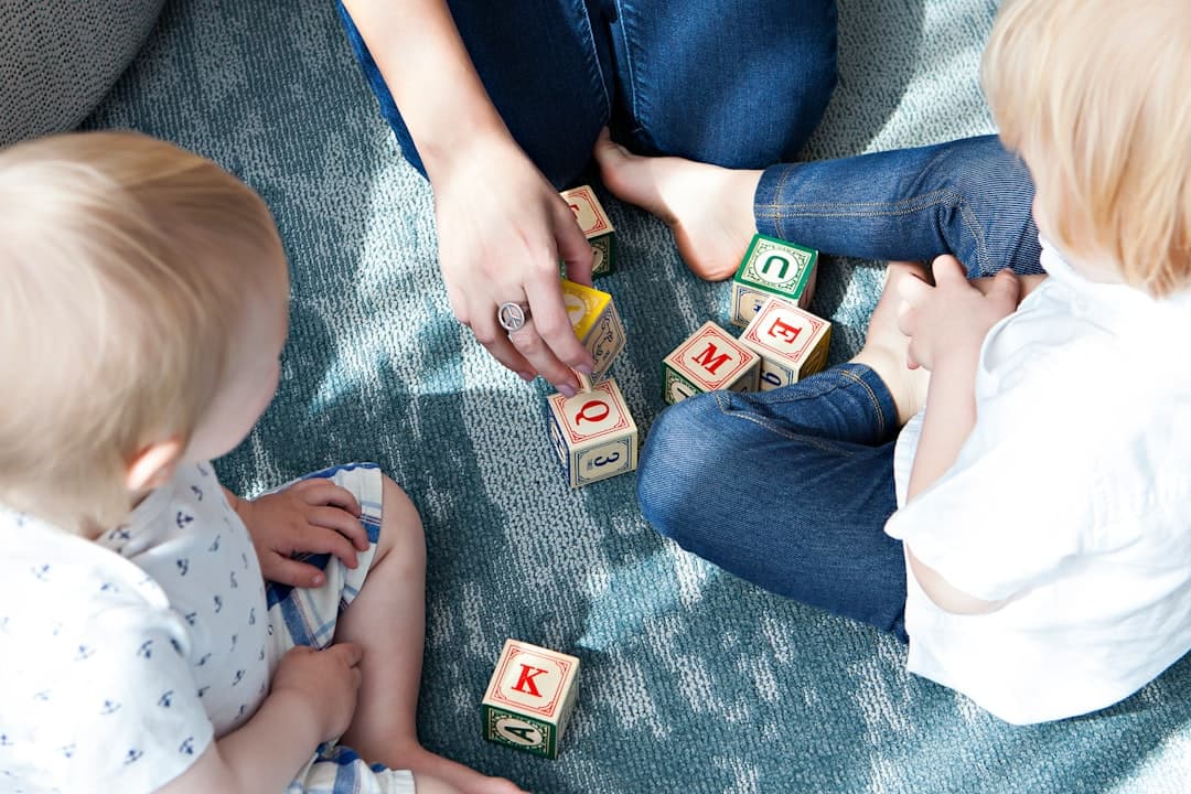 Caregiver and children playing with blocks